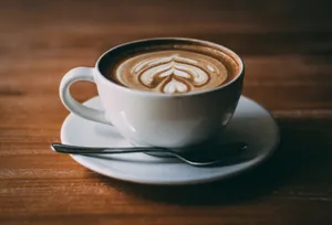 white ceramic teacup with coffee latte art jigsaw puzzle