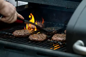 person grilling hamburger patties jigsaw puzzle