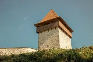 a stone building with a pointed roof jigsaw puzzle