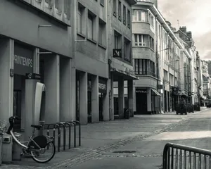 a bicycle parked on the side of a street jigsaw puzzle