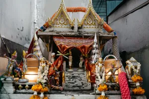 Detailed shot of a decorated Hindu shrine with ornate figures and vibrant garlands. jigsaw puzzle