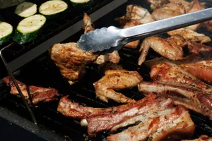 Juicy meat and zucchini being grilled on a barbecue under the summer sun. jigsaw puzzle