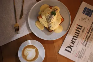 Top view of a delicious toast with creamy sauce and cappuccino, perfect for breakfast. jigsaw puzzle