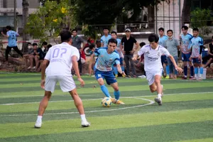 Players energetically compete in a local soccer match while spectators watch intently. jigsaw puzzle