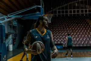 Male basketball players training and practicing in an indoor gym with basketballs and hoops. jigsaw puzzle