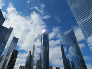 Modern architectural skyline with reflective skyscrapers under a bright blue sky in Chicago, Illinois. jigsaw puzzle
