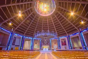 Explore the vibrant interior of Liverpool Metropolitan Cathedral with its stunning stained glass and architectural beauty. jigsaw puzzle