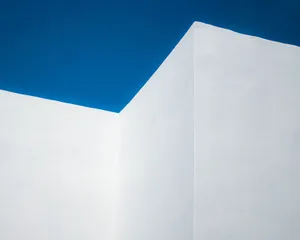 A striking minimalist image of a geometric white wall set against a clear blue sky in Rabat, Morocco. jigsaw puzzle