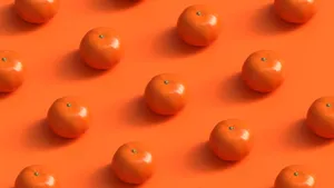 A geometric pattern of fresh, vibrant oranges on an orange background, showcasing symmetry and vivid color. jigsaw puzzle