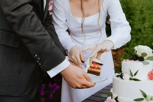 a man and a woman cutting a cake together jigsaw puzzle