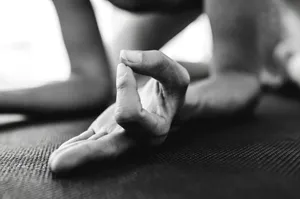 grayscale photo of persons hand jigsaw puzzle