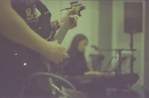Musician playing electric guitar, keyboardist in background jigsaw puzzle