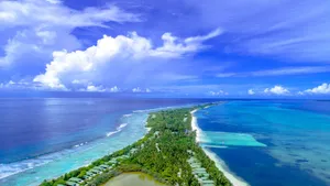 Discover the stunning coastline and lush greenery of Addu City, Maldives from above. jigsaw puzzle