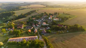 Drone captures a picturesque village surrounded by farmland and rolling hills in Petrovice II, Česko. jigsaw puzzle