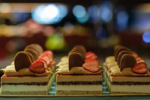 Close-up of scrumptious layered desserts topped with chocolate and strawberries. jigsaw puzzle