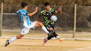 Two soccer players in action during a competitive outdoor match. jigsaw puzzle