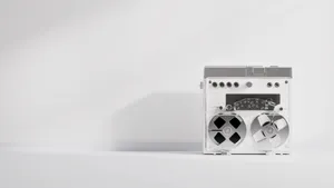 Classic reel-to-reel tape recorder in a minimalist composition with neutral tones. jigsaw puzzle