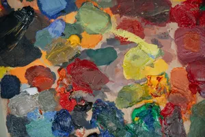 A colorful assortment of oil paints smeared on a canvas, showcasing various vibrant hues. jigsaw puzzle