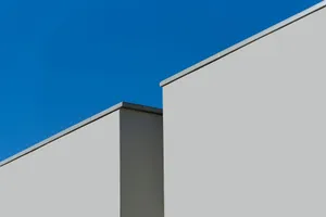 Minimalist modern architecture showcasing geometric lines against a clear blue sky. jigsaw puzzle