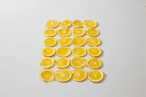 From above composition of fresh juicy oranges cut in slices and laid on white background jigsaw puzzle