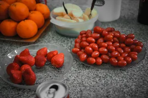 strawberries and orange fruits on white ceramic bowl jigsaw puzzle