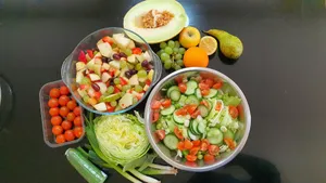 a table topped with bowls of vegetables and fruit jigsaw puzzle