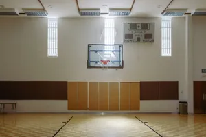an indoor basketball court with a basketball hoop jigsaw puzzle