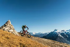 a person riding a bike on a mountain jigsaw puzzle