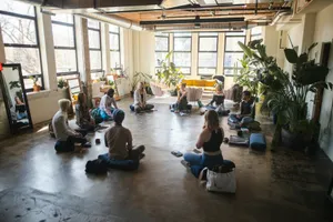 a group of people sitting in a circle in a room jigsaw puzzle