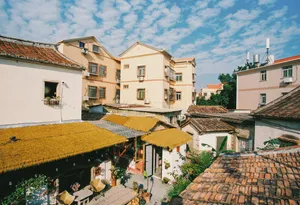 Rooftops of old buildings under a cloudy blue sky. jigsaw puzzle