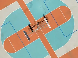 Drone shot of a colorful basketball court in Campbell, California, showcasing geometric designs. jigsaw puzzle