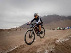 Cyclist in sportswear competing in an off-road desert race on a mountain bike. jigsaw puzzle