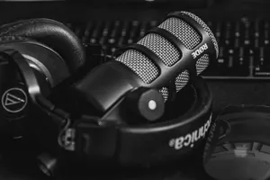 Close-up of a studio microphone and headphones in a black and white composition, perfect for audio and podcast themes. jigsaw puzzle