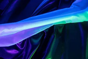 A stunning display of colorful iridescent fabric with vibrant colors and a modern, abstract aesthetic. jigsaw puzzle