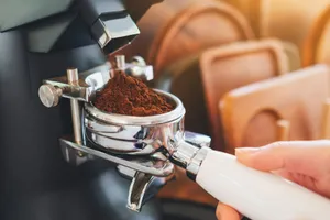 person pouring brown powder on silver cup jigsaw puzzle