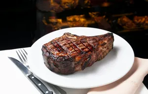 a steak on a plate with a fork and knife jigsaw puzzle