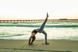 woman doing yoga pose on seashore jigsaw puzzle