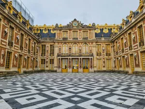 a large building with a checkered floor in front of it jigsaw puzzle