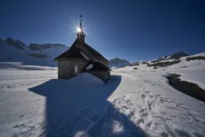 church in snow field during daytime jigsaw puzzle