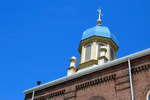 Blue dome with a cross on a brick building. jigsaw puzzle
