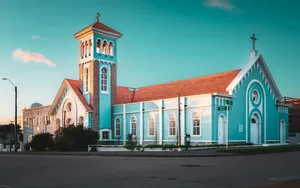 a large blue church with a red roof jigsaw puzzle