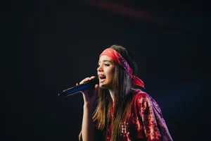 woman in red dress holding microphone jigsaw puzzle