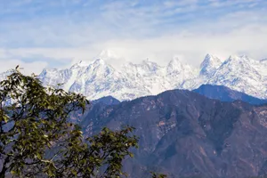 Breathtaking view of the snow-capped Himalayan mountains in Uttarakhand, India with lush foreground. jigsaw puzzle