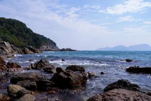 Breathtaking view of a rocky shoreline and blue ocean under a clear sky, perfect for nature and travel imagery. jigsaw puzzle