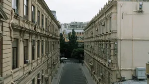 A scenic view of classic residential buildings lining a narrow street in Baku, Azerbaijan. jigsaw puzzle