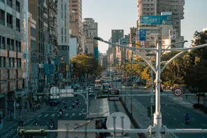 A busy street scene showcasing the vibrant urban life in a modern cityscape. jigsaw puzzle