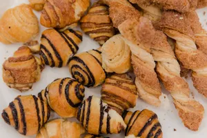 Delicious assortment of pastries including chocolate-filled croissants and cinnamon twists. jigsaw puzzle