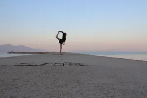 A person performing yoga at sunset on a dock in Kuşadası, Turkey. jigsaw puzzle