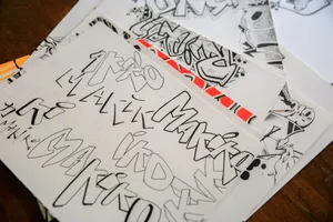 Creative stack of black and white graffiti sketches showcasing bold artistic lettering. jigsaw puzzle