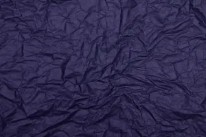 Dark blue textured wrinkled paper surface ideal for backgrounds or creative projects. jigsaw puzzle